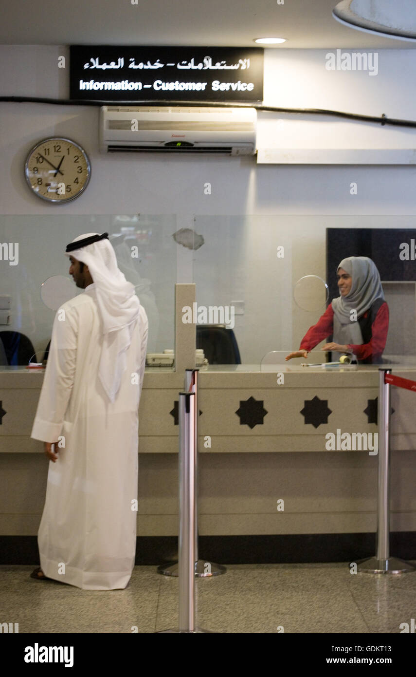 A man at the information desk, Sharjah International Airport, July 2007