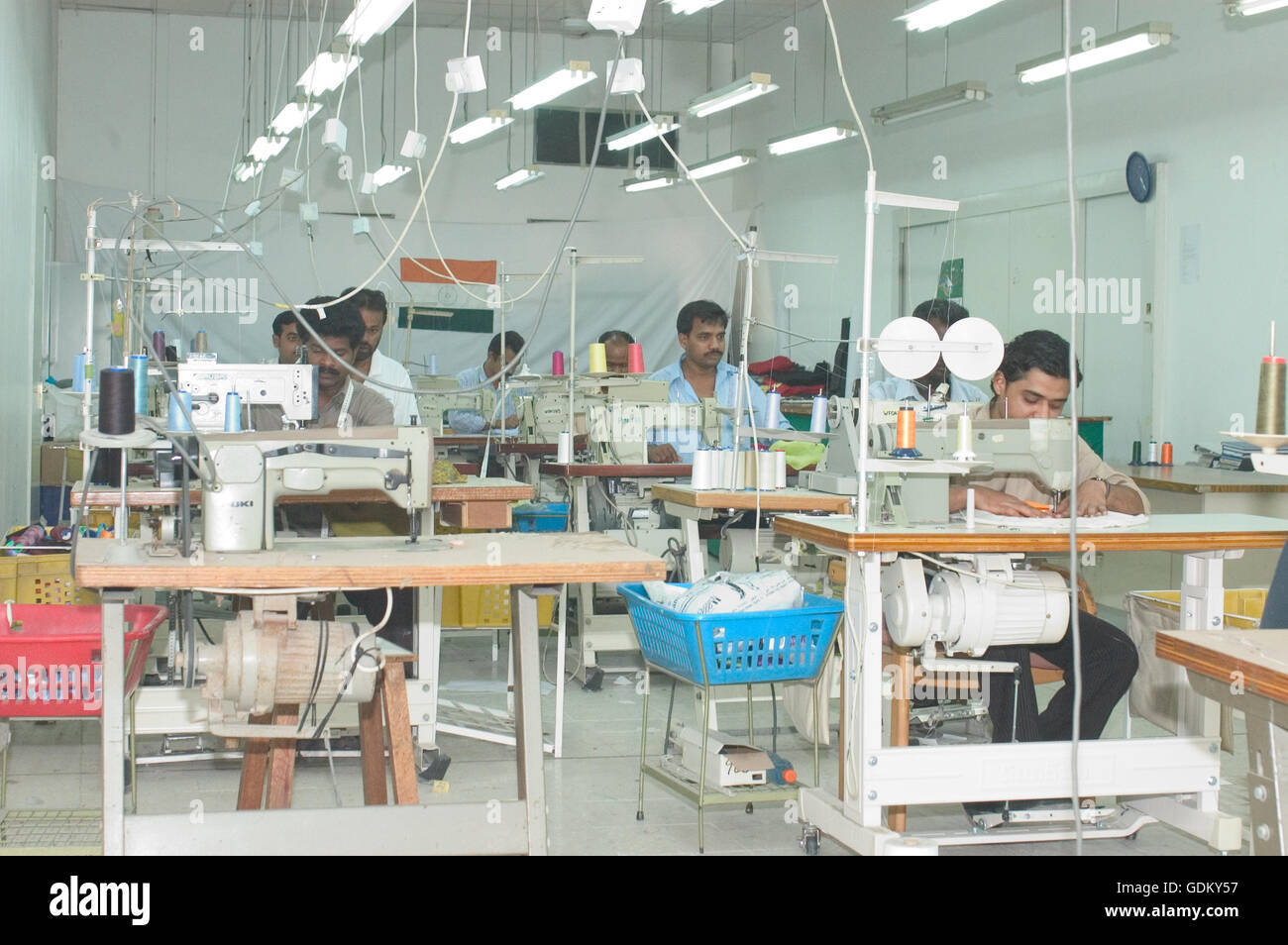 Tailors busy at work on their sewing machines, Dubai, UAE Stock Photo