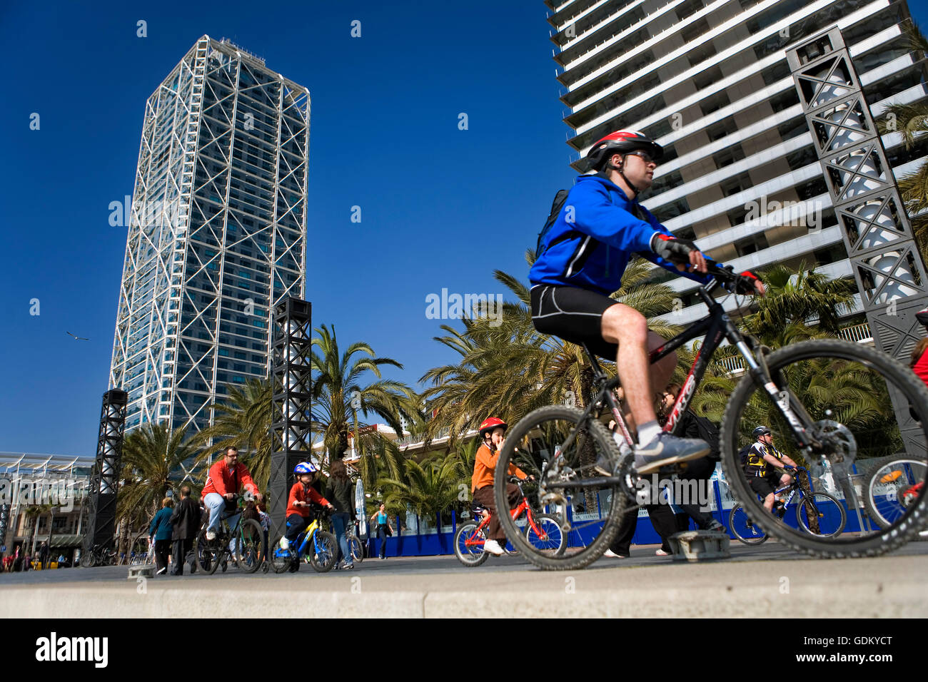 People riding Bike in Passeig Maritim of Olimpic harbour,Barcelona