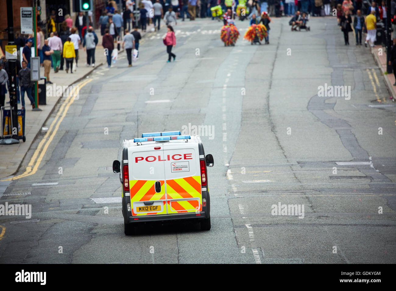 Deansgate manchester   main road through city centre A Police van responding to a 999 alert Police  officer  constable PC bobby Stock Photo