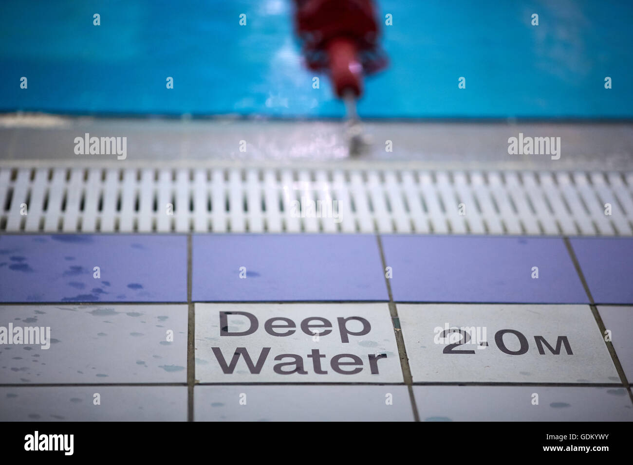 Swimming baths deep water warning sign 2 meters deep Stock Photo