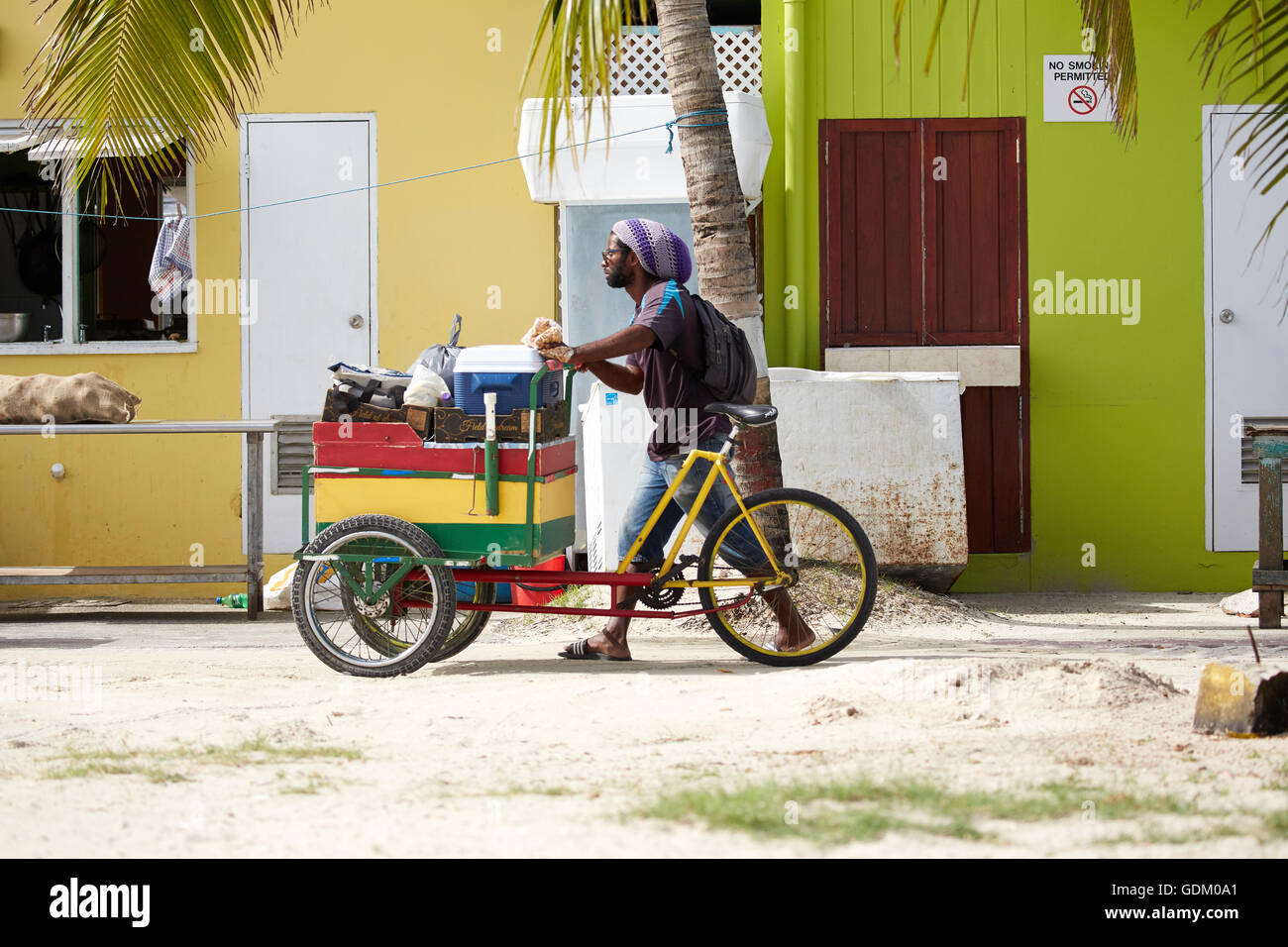 The Lesser Antilles Barbados Parish Saint Michael west indies capital The coastal town of Oistins beach trader on 3 wheeled bike Stock Photo