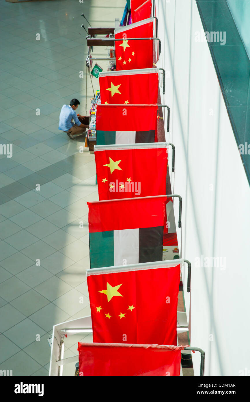 Chinese and UAE flags hanging from a wall in Dragon Mart, Dubai, UAE
