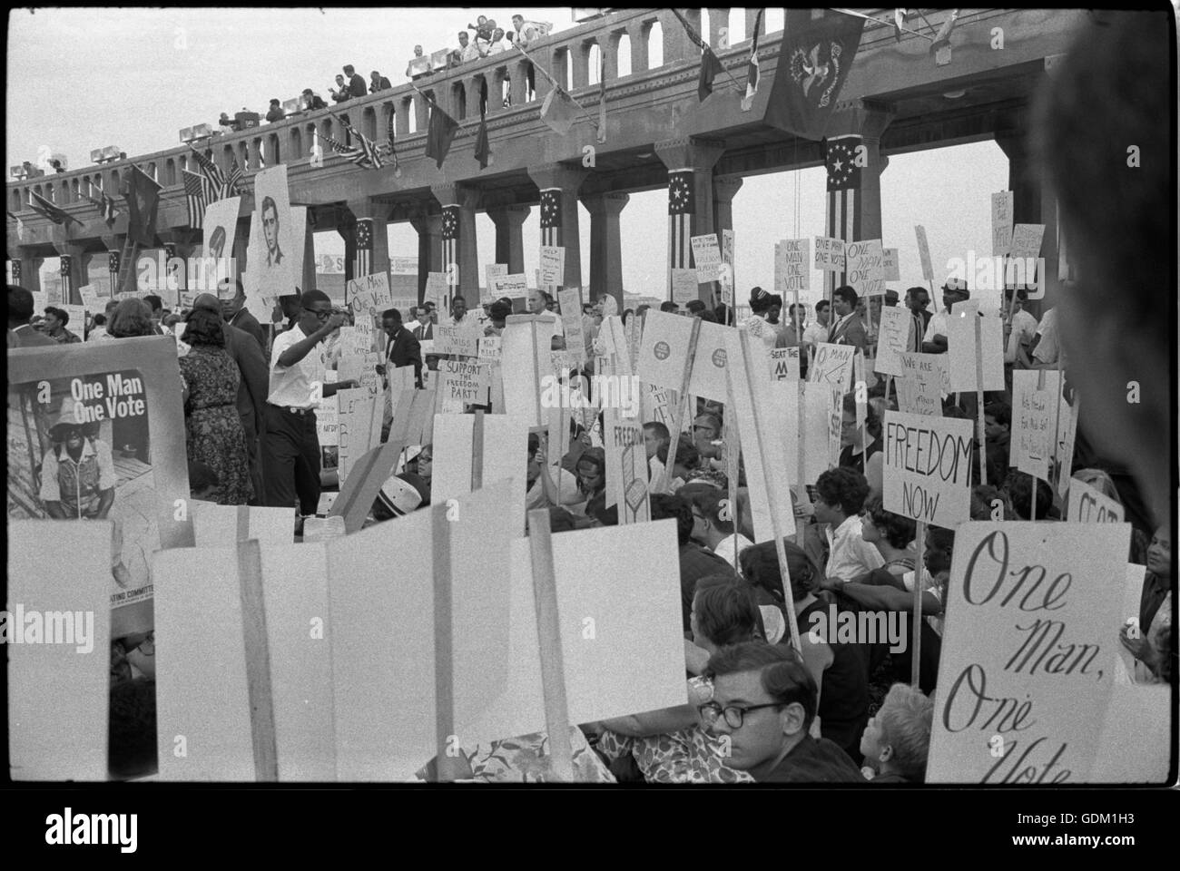 African-American and white Mississippi Freedom Democratic Party supporters demonstrating outside the 1964 Democratic National Convention, Atlantic City, New Jersey; some hold signs with portraits of slain civil rights workers Andrew Goodman and Michael Schwerner.  Warren K. Leffler, photographer. Stock Photo