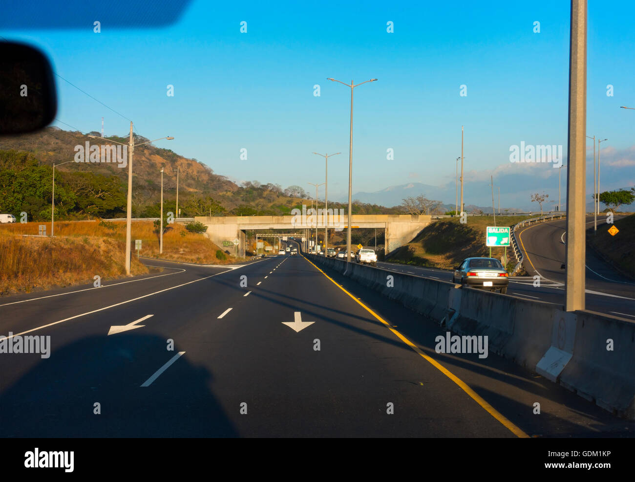 Cars driving on the wrong side of the road along Highway 27 (Autopista José Maria Castro Madriz). Stock Photo