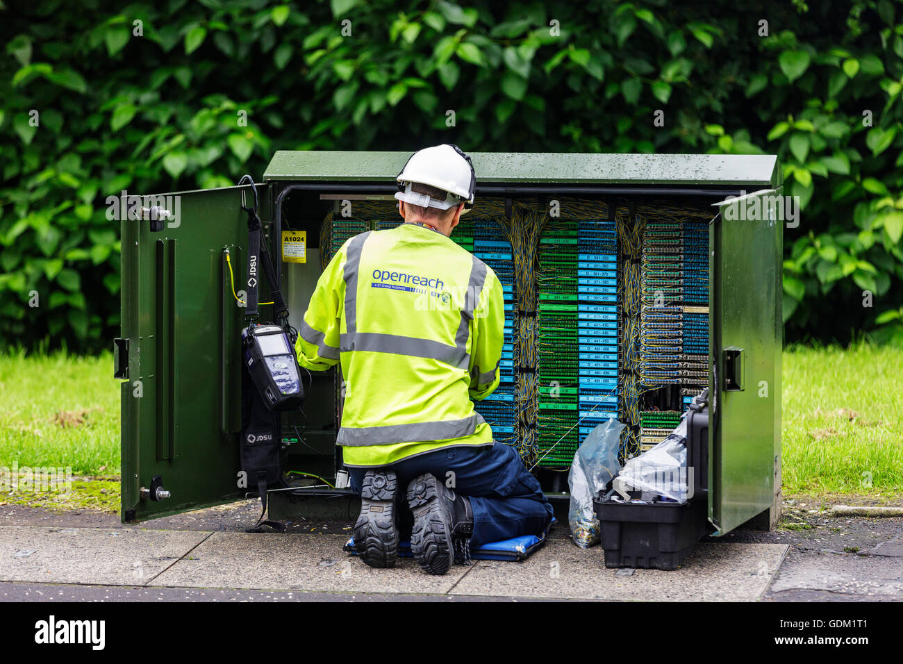 Openreach telephone and internet technician repairing a switch box, Scotland, UK Stock Photo