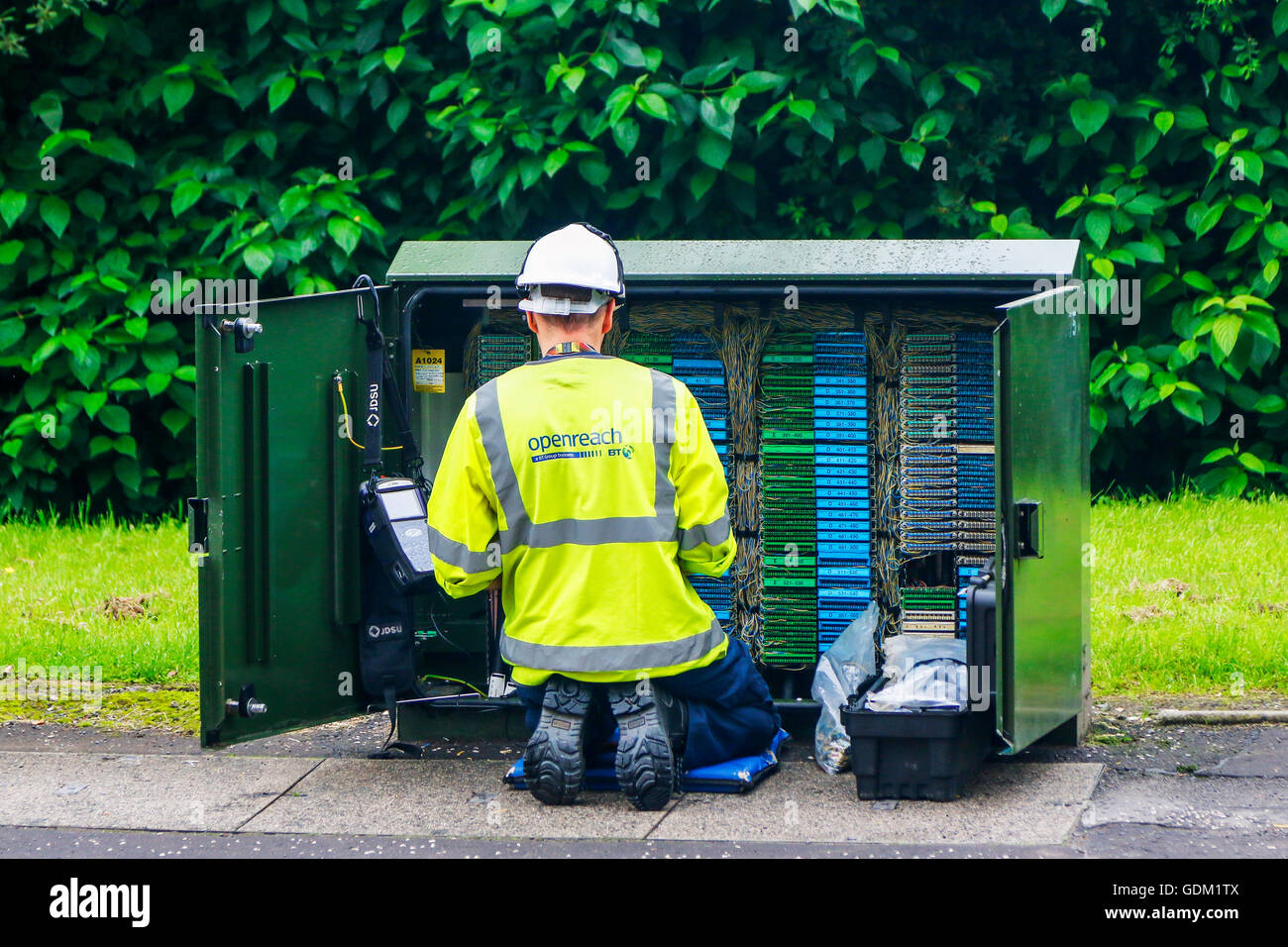 Openreach telephone and internet technician repairing a switch box, Scotland, UK Stock Photo