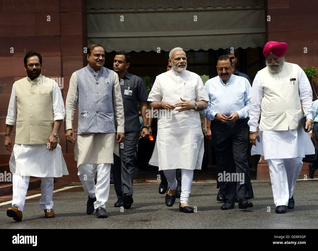 (160718) -- NEW DELHI, July 18, 2016 (Xinhua) -- Indian Prime Minister Narendra Modi (C, front) arrives at Parliament House with his cabinet colleagues on the first day of monsoon session in New Delhi, India, July 18, 2016. The monsoon session of Indian lower house began on Monday but was adjourned shortly to Tuesday due to the death of Madhya Pradesh MP Dalpat Singh Paraste. (Xinhua/Stringer) (sxk) Stock Photo