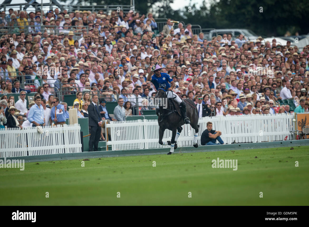 Midhurst, England, 17th July 2016. Facundo Pieres of King Power Foxes polo team hit the ball with a grandstand of spectators looking on during the final of the Jaeger LeCoultre Gold Cup Tournament. Credit:  Anthony Hatley/Alamy Live News Stock Photo