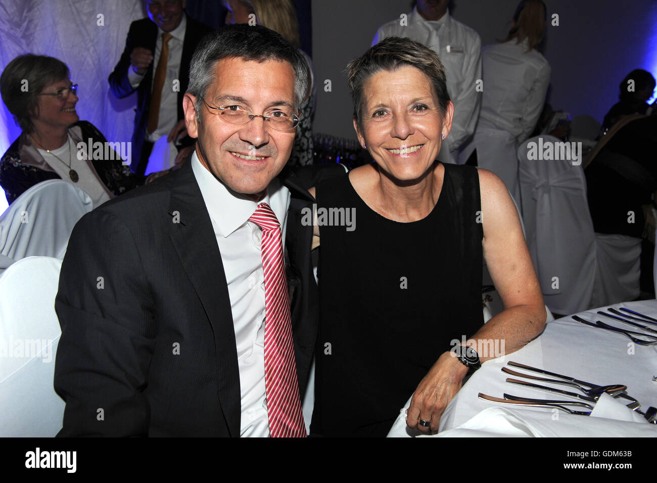 Bad Griesbach, Germany. 16th July, 2016. Herbert Hainer, CEO of Adidas AG  (l) and his wife Angelika enjoying the gala that is being held as part of  the 29th Kaiser Cup golf