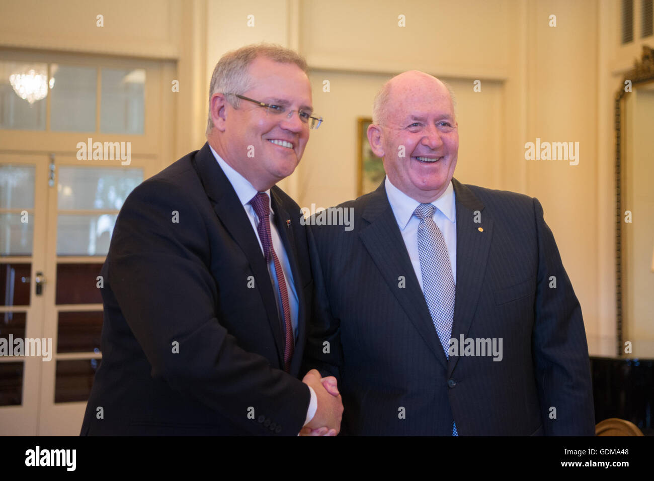 Canberra, Australia. 19th July, 2016. Scott Morrison (L) is sworn in as Australian Treasurer at a ceremony by Governor-General Peter Cosgrove at the Government House in Canberra, Australia, July 19, 2016. Credit:  Xu Haijing/Xinhua/Alamy Live News Stock Photo