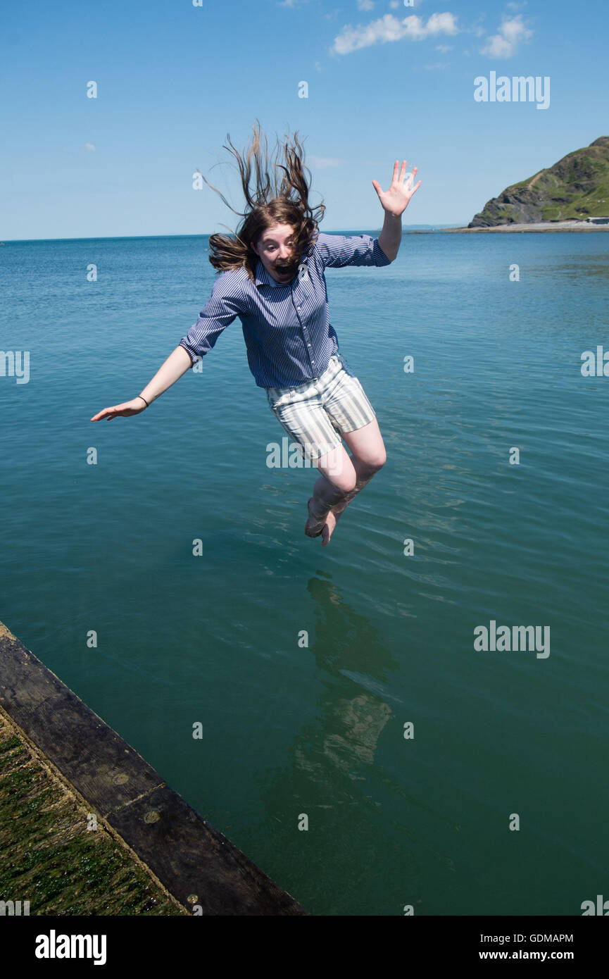 Teenagers jumping off jetty hi-res stock photography and images - Alamy