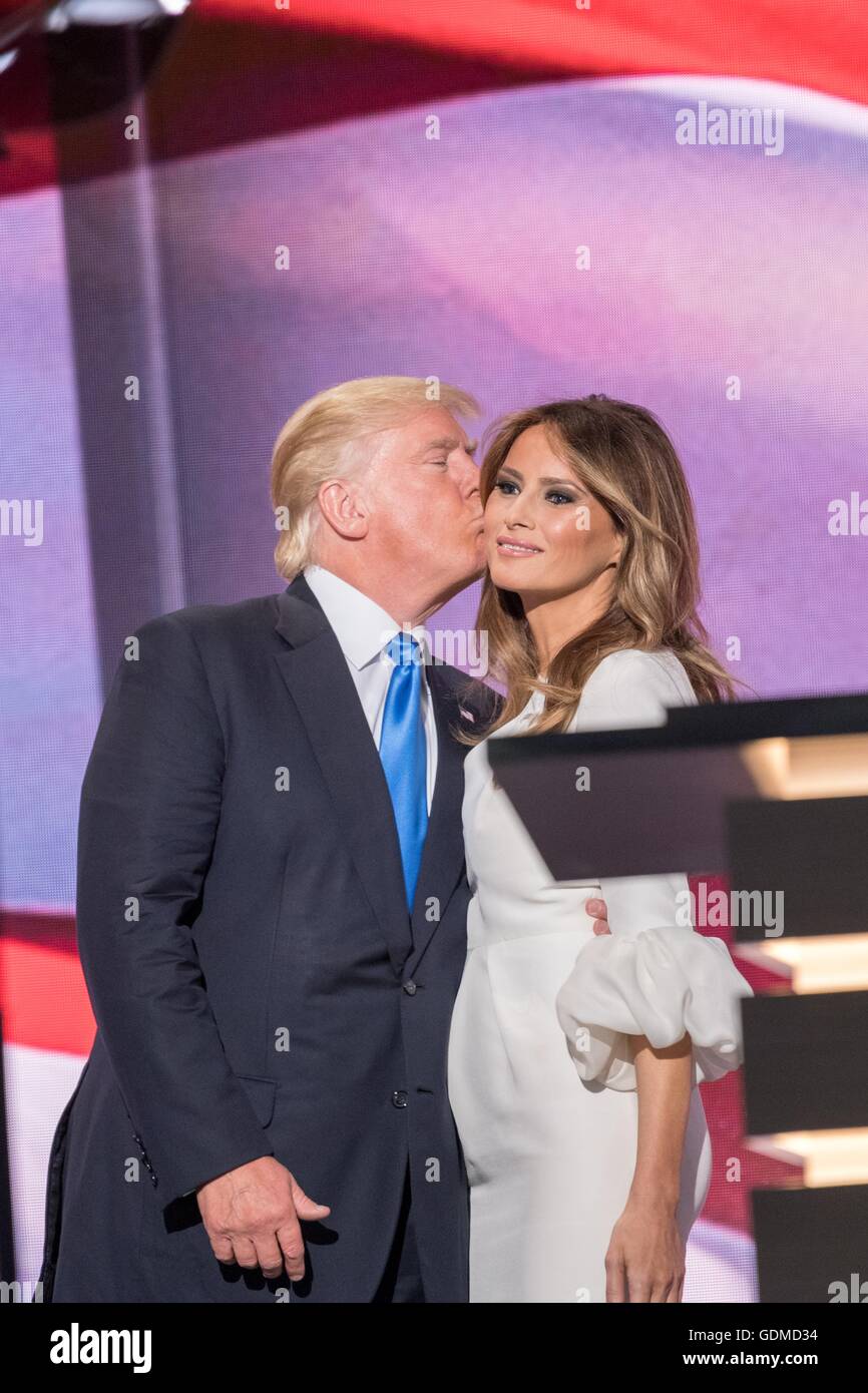 GOP presidential nominee Donald Trump gives his wife Melania Trump a kiss following her address during the first day of the Republican National Convention at the Quicken Loans Center July 18, 2016 in Cleveland, Ohio. Stock Photo