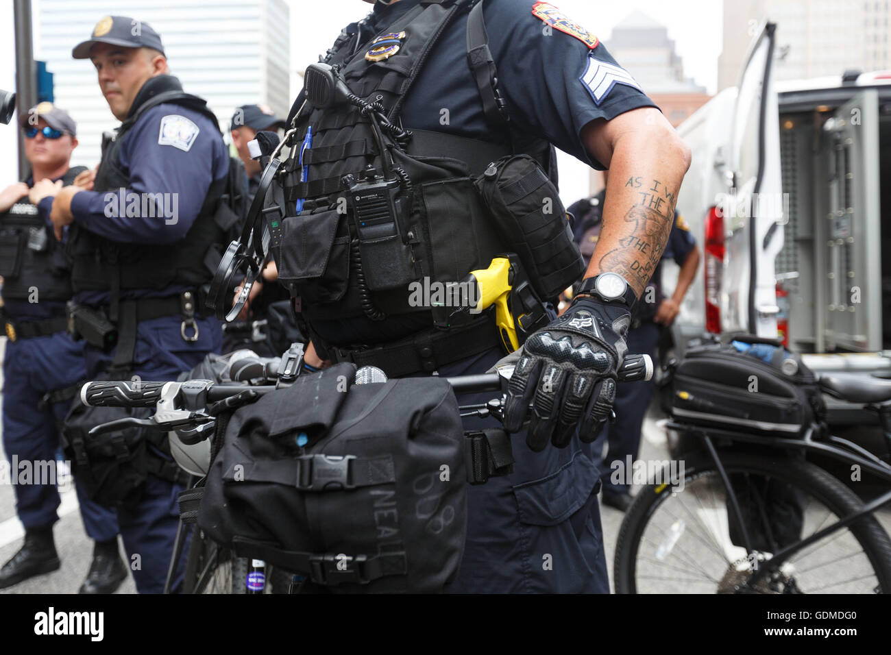 Cleveland, USA. 18th July, 2016. A police officer on bike watches a protest outside the Republican National Convention. Credit:  John Orvis/Alamy Live News Stock Photo