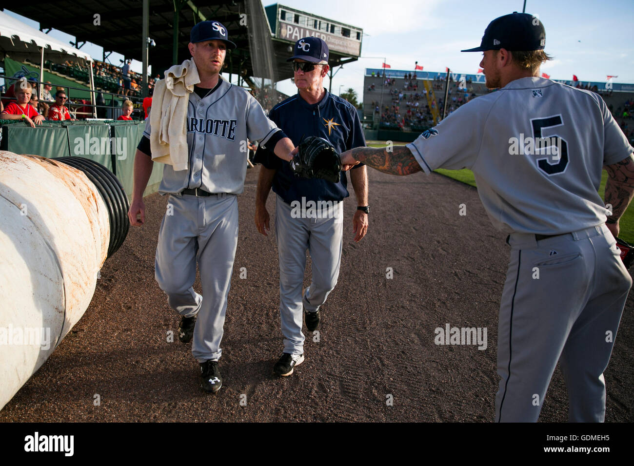 Daytona Beach, Florida, USA. 11th July, 2016. WILL VRAGOVIC | Times.Tampa Bay Rays starting pitcher Alex Cobb, left, gets a fist bump from Charlotte Stone Crabs pitcher Nick Sawyer, right, as he walks to the clubhouse with Charlotte Stone Crabs pitching coach Steve 'Doc' Watson, center, after being relieved after the first inning the game between the Charlotte Stone Crabs and Daytona Tortugas at Jackie Robinson Ballpark in Daytona Beach, Fla. on Monday, July 11, 2016. This was Cobb's second start of his rehab assignment with the Stone Crabs. (Credit Image: © Will Vragovic/Tampa Bay Times Stock Photo