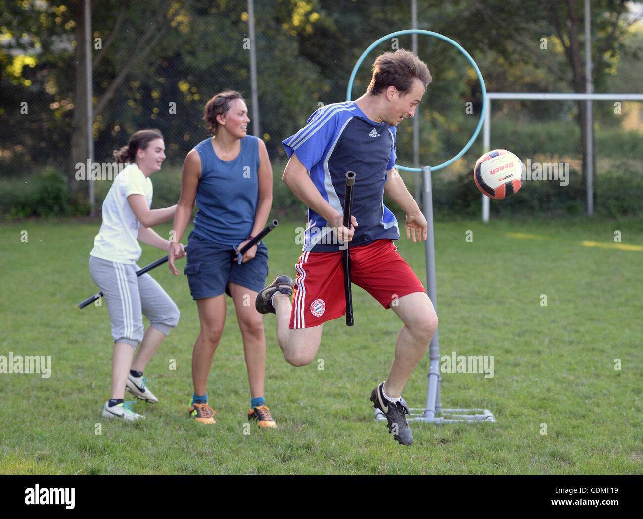 Freiburg, Germany. 23rd June, 2016. Quidditch players practise in Freiburg, Germany, 23 June 2016. The game originates from the Harry Potter books and is a mixture of handball, dodgeball and rugby. The Quidditch elites meet in Frankfurt on the Main on 23-24 July for the Quidditch World Championships. Foto: Patrick Seeger/dpa/Alamy Live News Stock Photo