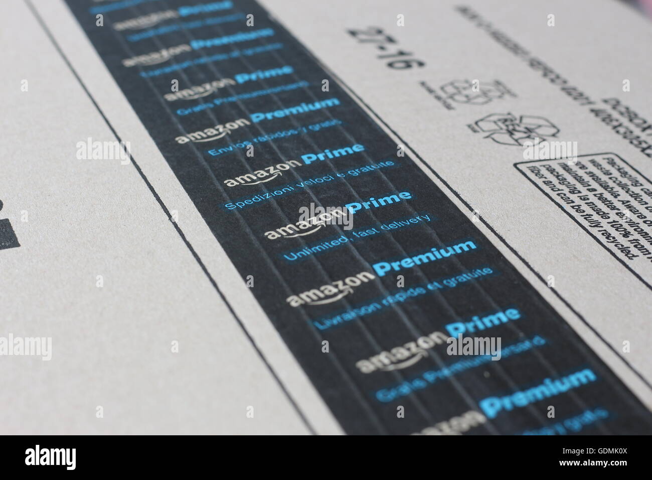 Amazon Prime logotype printed on cardboard box security scotch tape