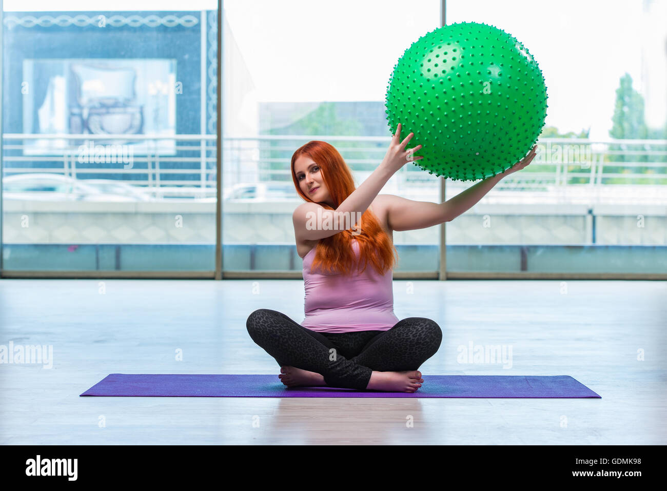 Woman working with swiss ball in the studio Stock Photo - Alamy