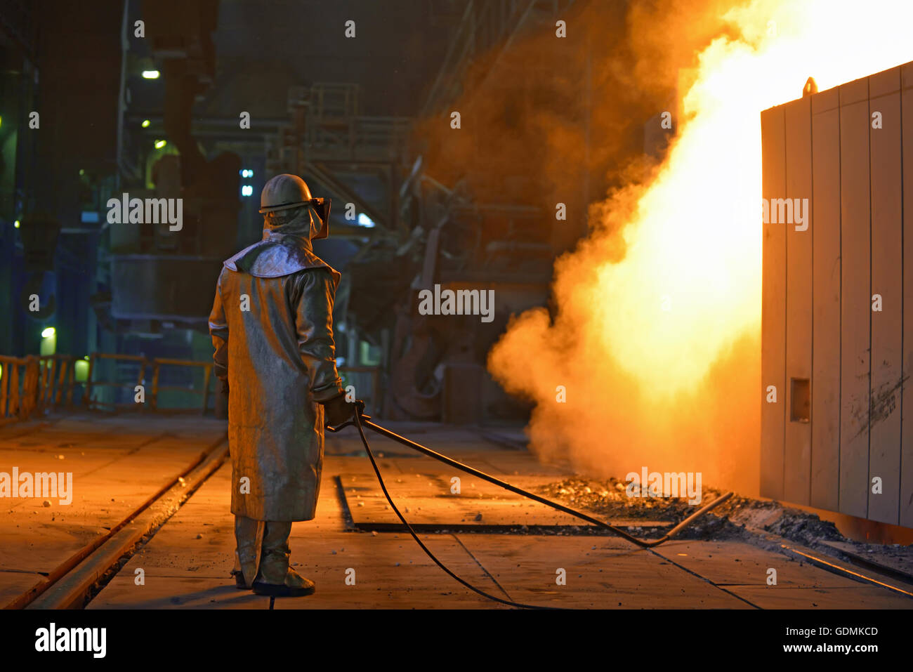 Industrial steel worker inside of steel plant Stock Photo