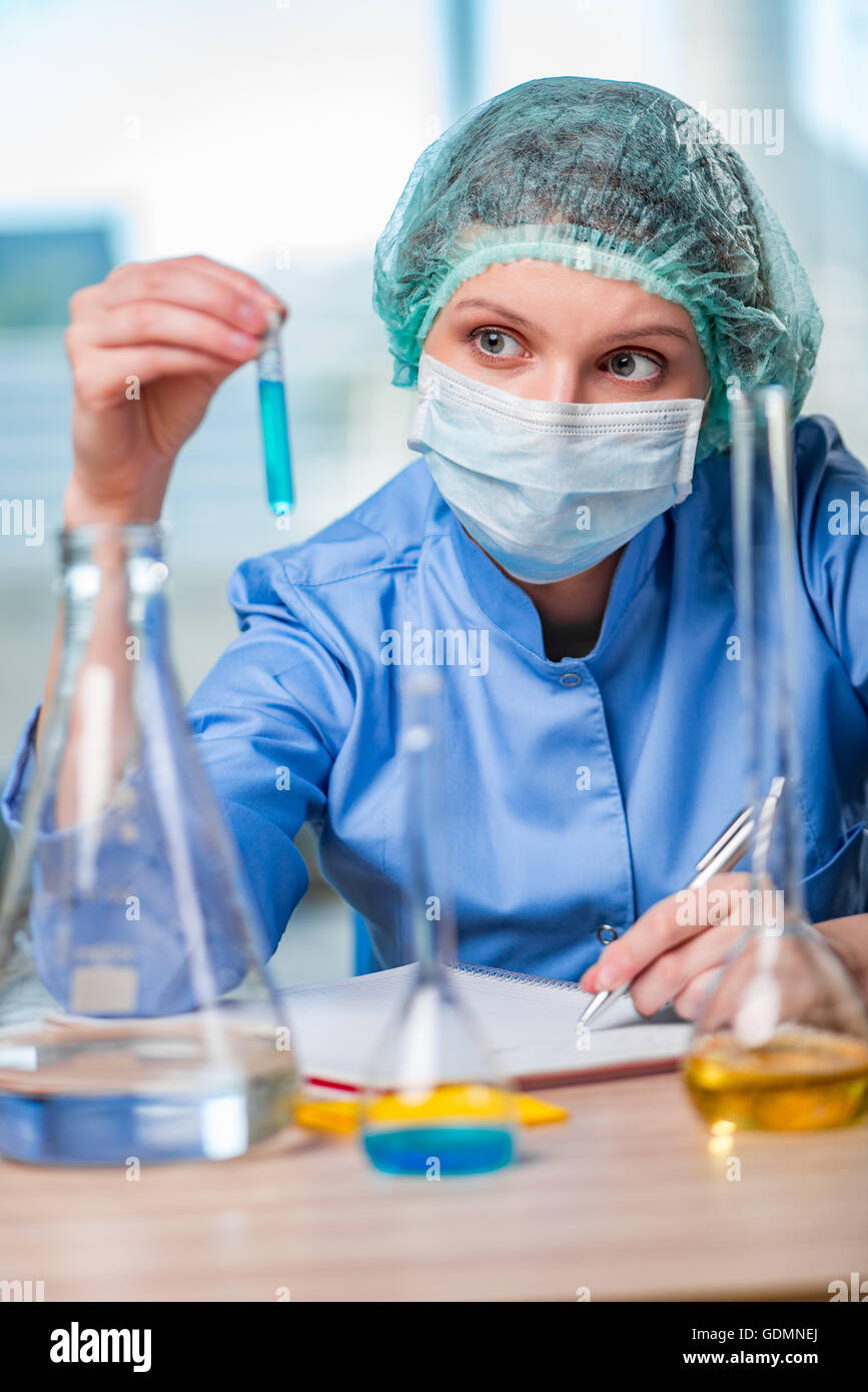 Experienced lab assistant working on chemical solutions Stock Photo Alamy