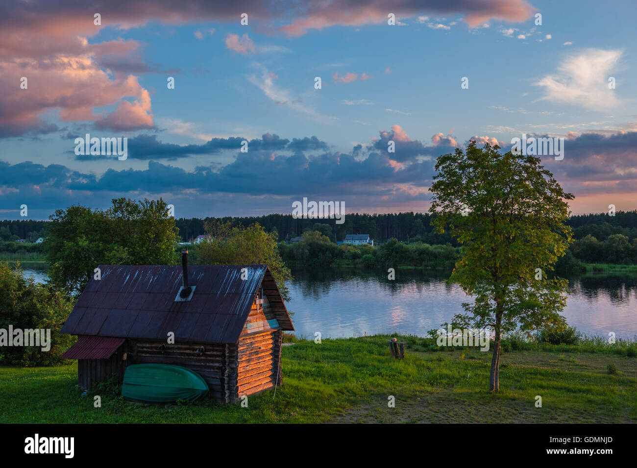 Wooden house on the river Stock Photo - Alamy