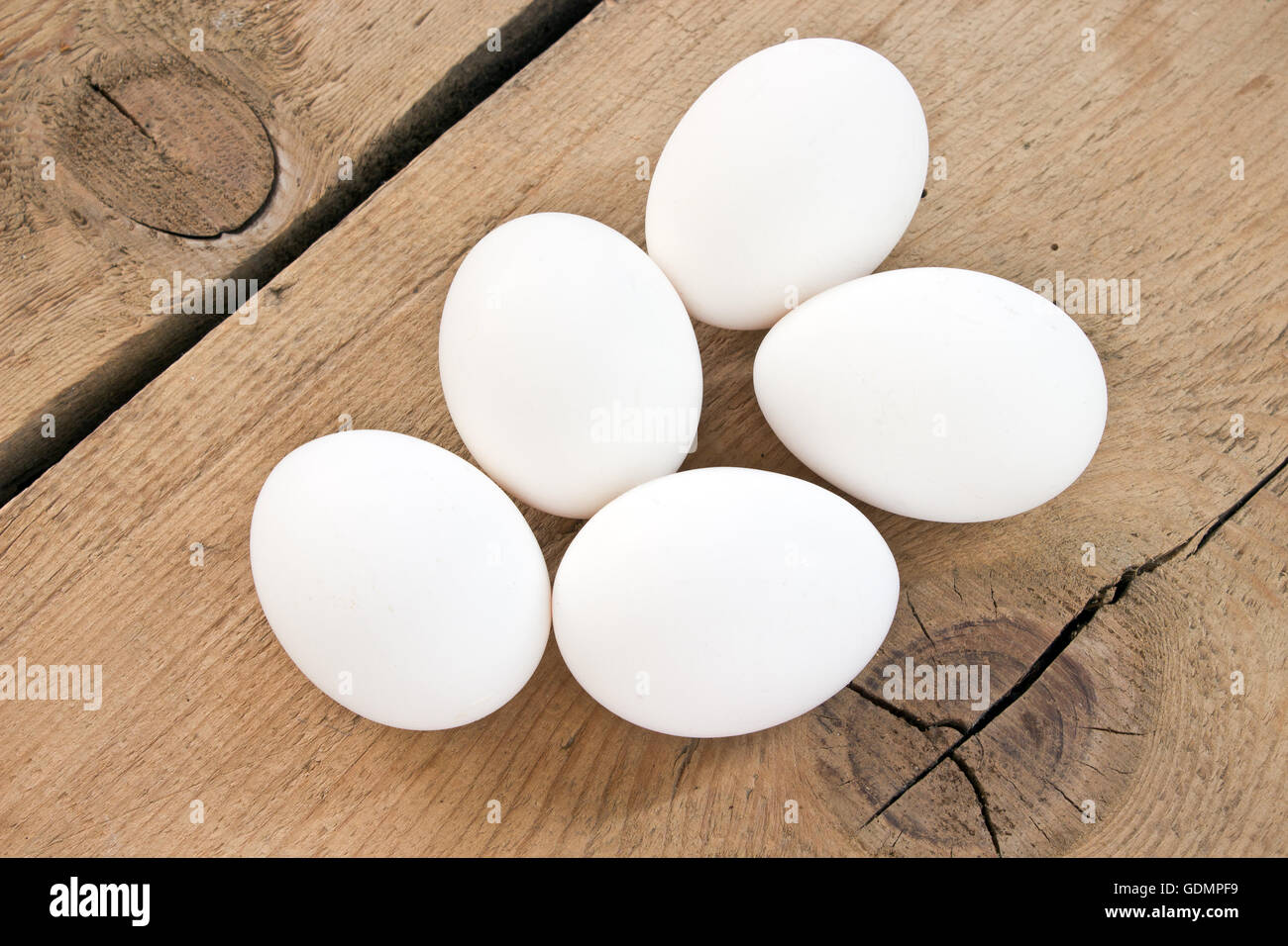 Chicken white eggs on wooden background Stock Photo