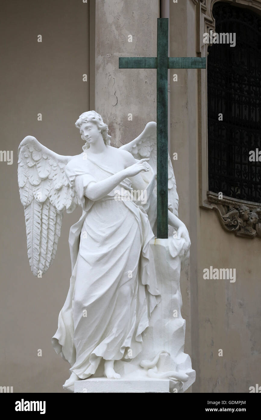 Angel statue in front of Karlskirche church in Vienna, Austria on ...