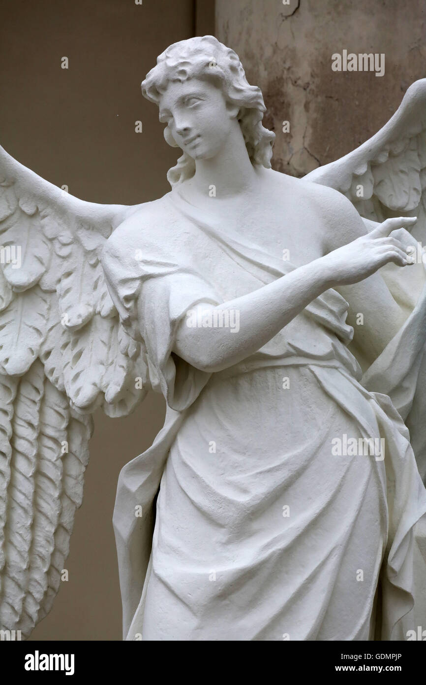 Angel statue in front of Karlskirche church in Vienna, Austria on ...