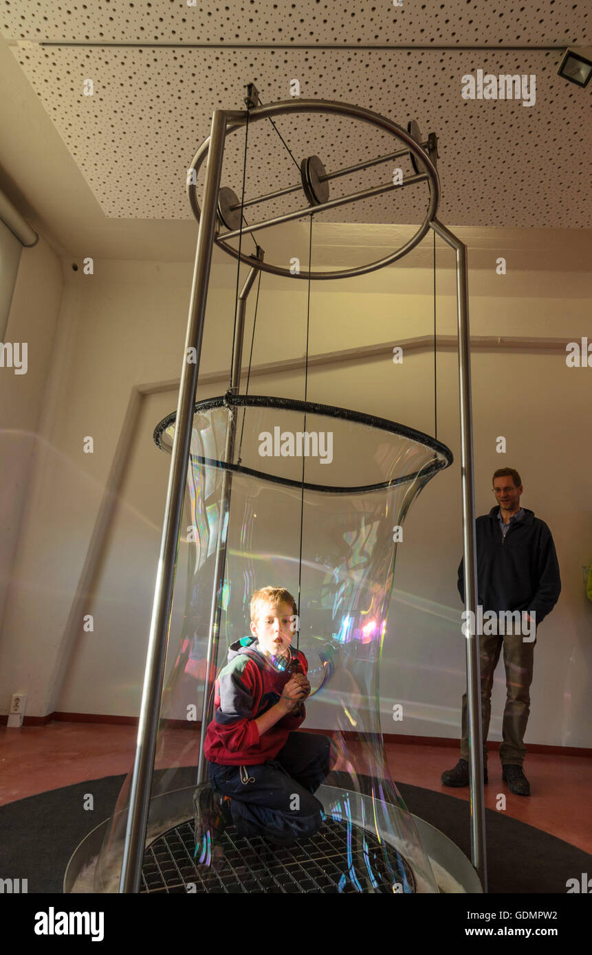 Dresden: Giant soap bubble and boy in the Math Adventure Land of Technical collections in the former Ernemann works, Germany, Sa Stock Photo