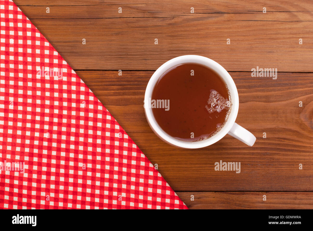 Tea table cloth on a wooden table. Stock Photo