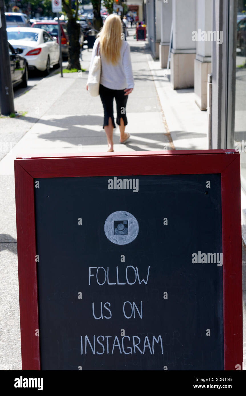 follow us on instagram sign on the sidewalk granville street vancouver british columbia canada - follow instagram sign
