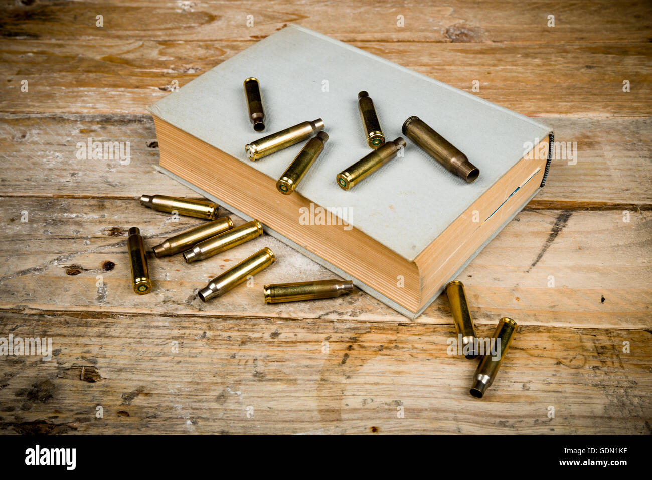 Still life  with old book and bullets, a mystery novel concept Stock Photo
