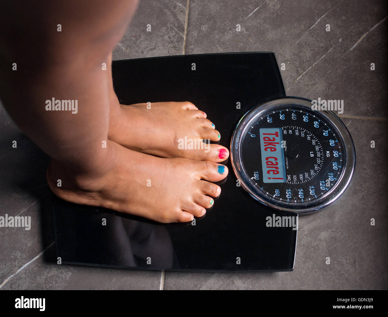 Weight loss scale celebrating hi-res stock photography and images - Alamy