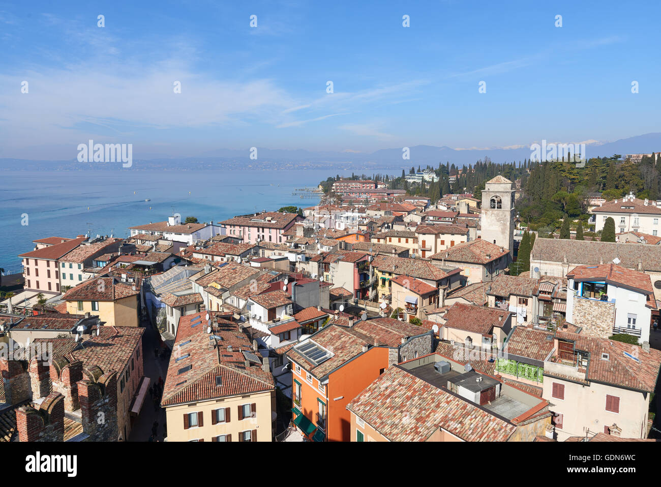 Landscape of Sirmione Village with Lake Garda and Alps. It is a famous vacation place in the northern Italy. Stock Photo