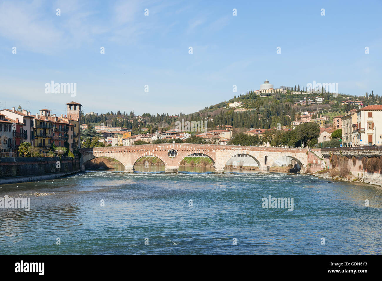 Ponte Pietra, a Roman arch bridge crossing the Adige River. The bridge was Completed in 100 B.C. Stock Photo