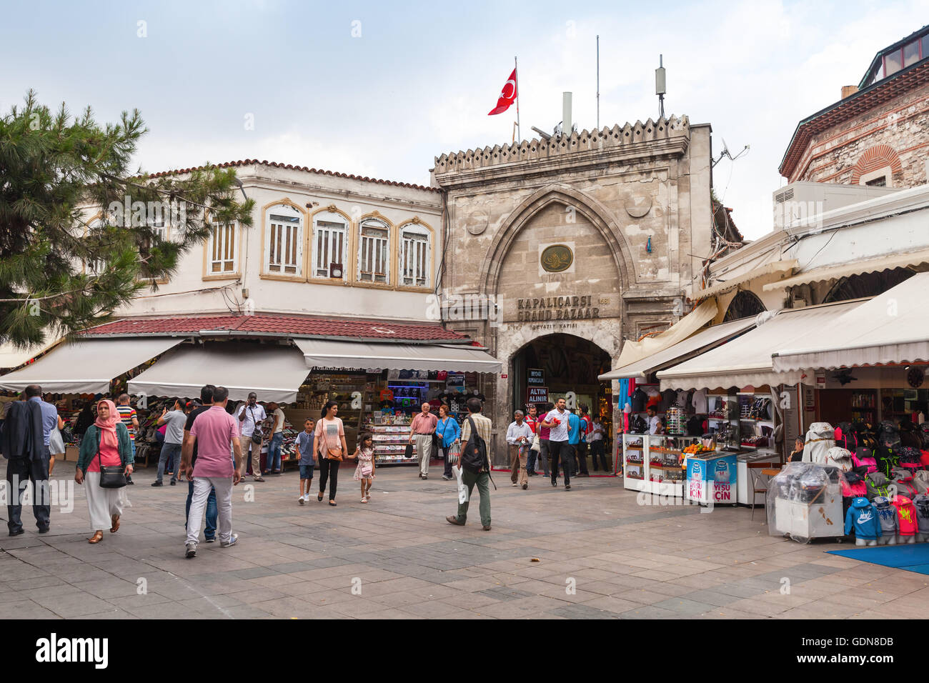 Istanbul, Turkey - June 28, 2016: Ordinary people walk on the street in old central district of Istanbul near Grand Bazaar entra Stock Photo