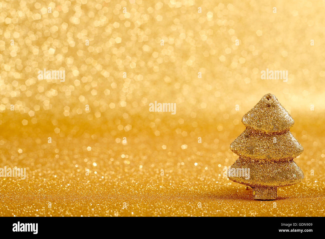 Golden christmas fir tree decoration on glitter background Stock Photo ...