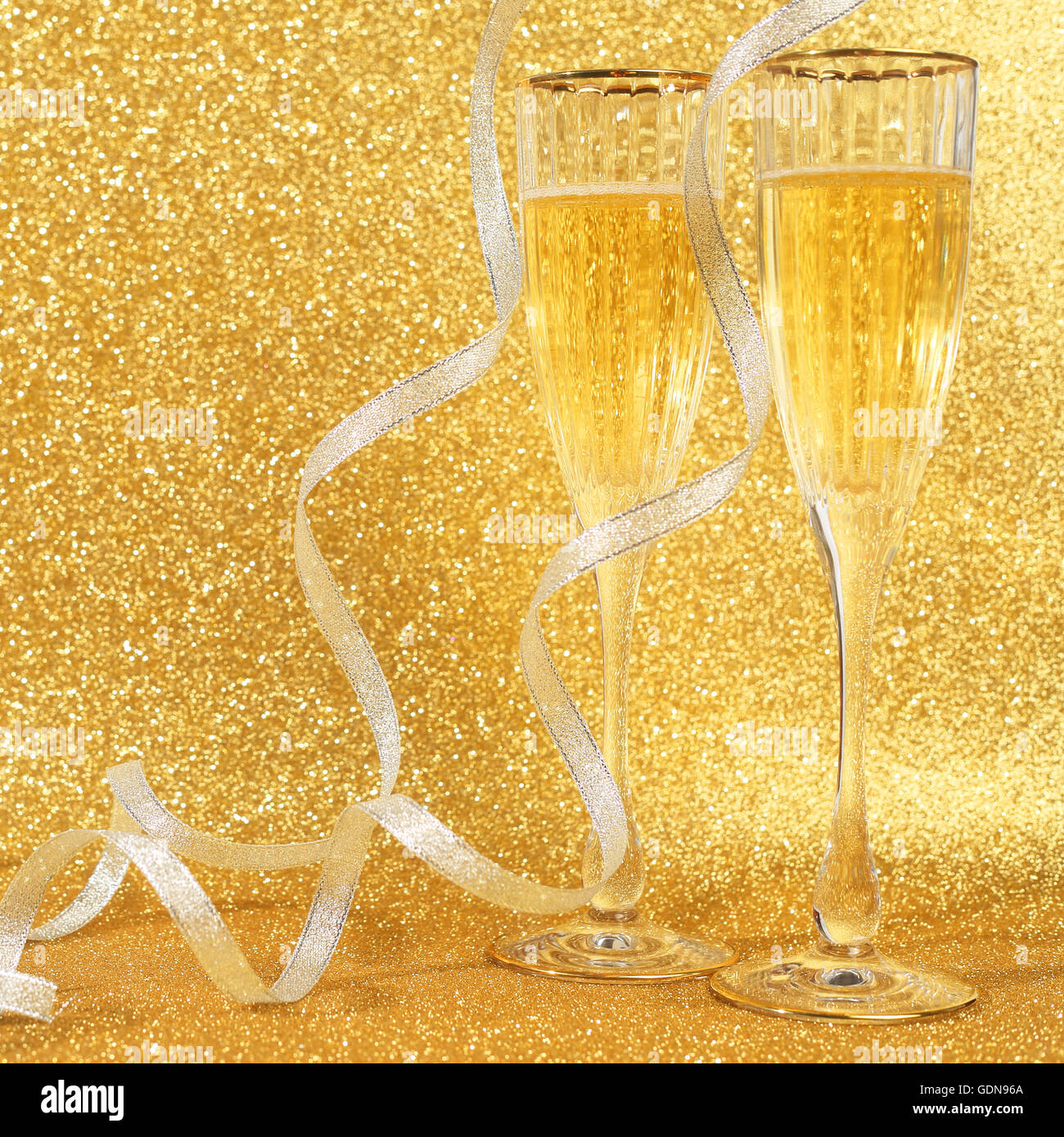 Champagne glasses golden ribbon hi-res stock photography and images - Alamy