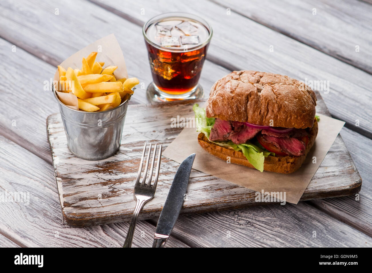 Bucket of fries and sandwich Stock Photo Alamy
