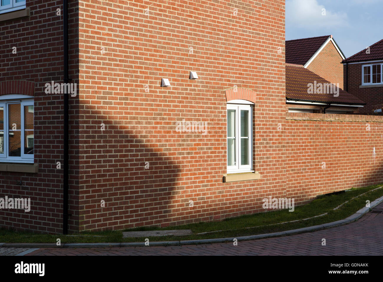 Suburban landscape, Swindon, UK with red brick house on a housing estate. Stock Photo