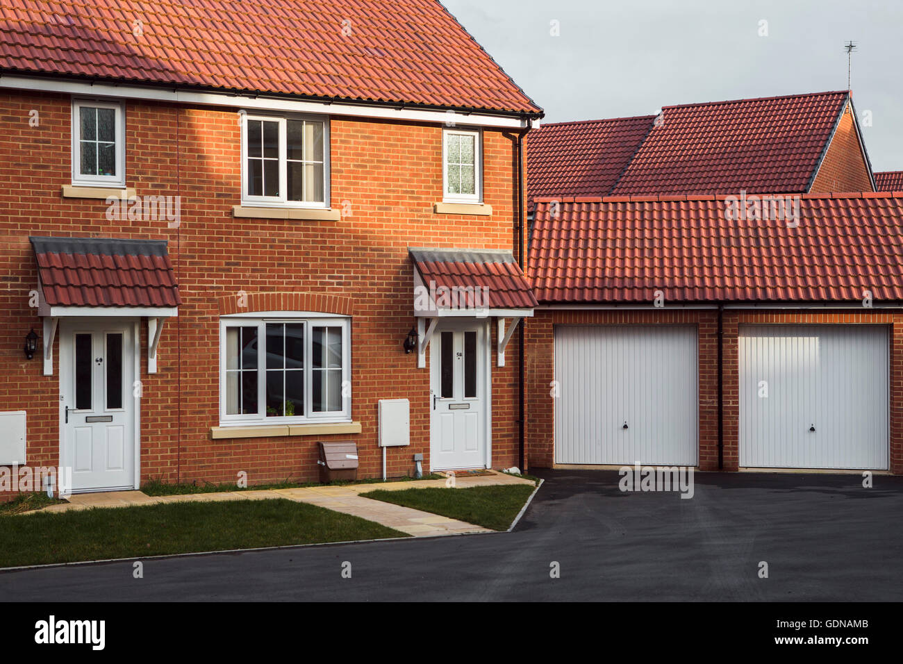 Suburban landscape, Swindon, UK with red brick house on ahousing estate. Stock Photo