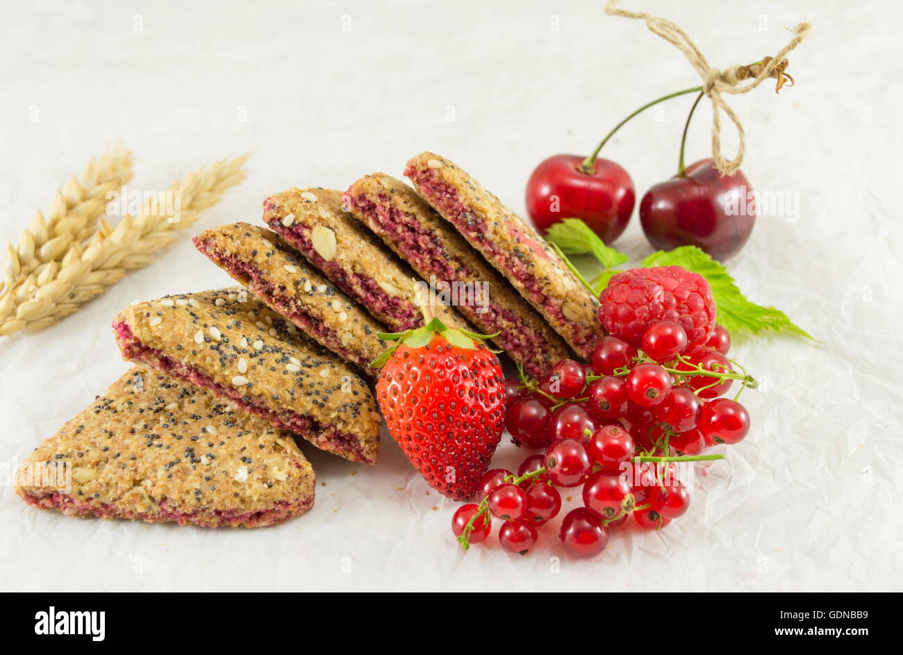 Integral biscuits with strawberry currant and cherry Stock Photo
