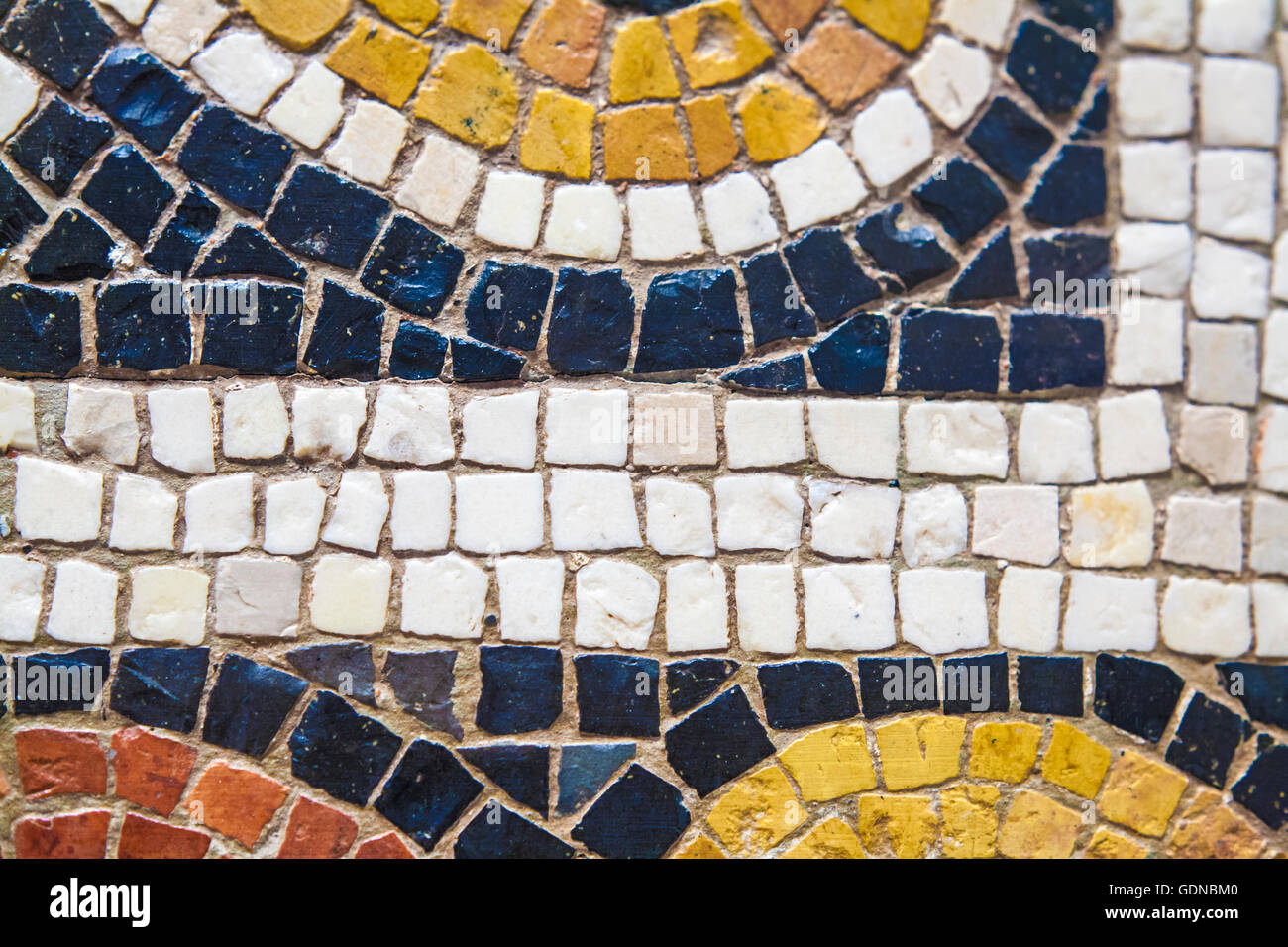 Roman polychrome mosaic with geometrical shapes. Closeup Stock Photo