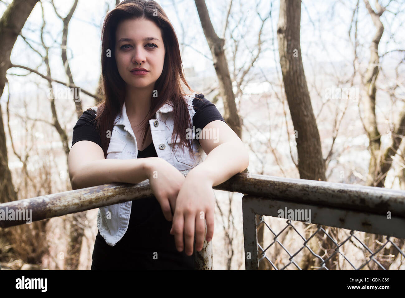 Portrait of young beautiful woman in urban background Stock Photo - Alamy