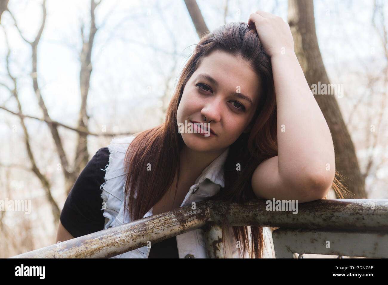 Portrait of young beautiful woman in urban background Stock Photo - Alamy