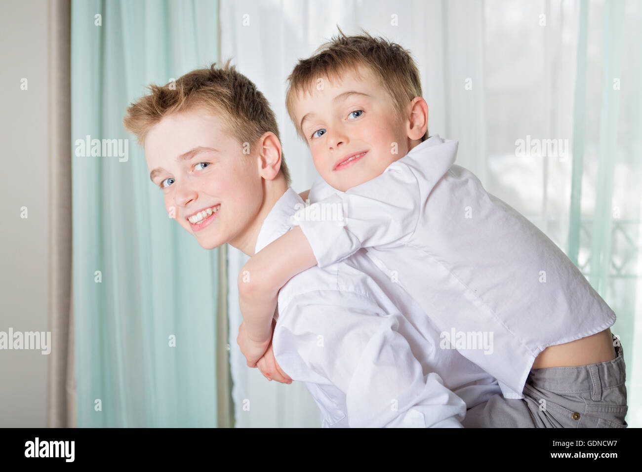 boys playing and embracing at home Stock Photo - Alamy