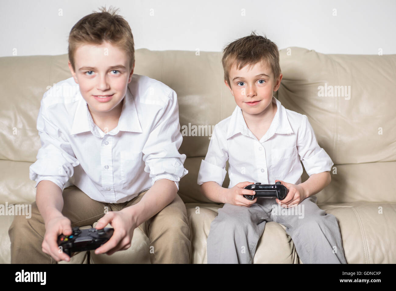 boys having lots of fun with video games Stock Photo