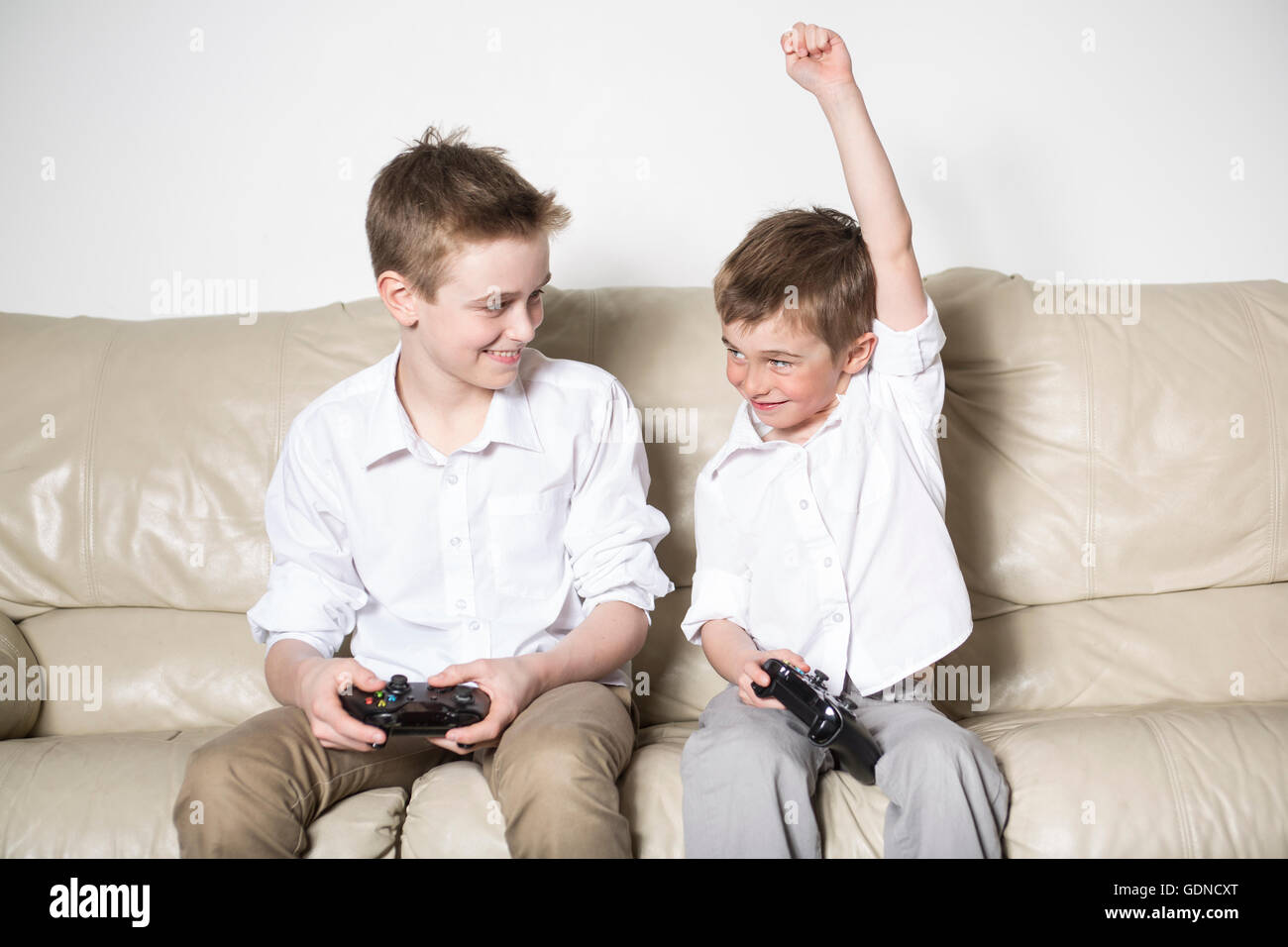 boys having lots of fun with video games Stock Photo
