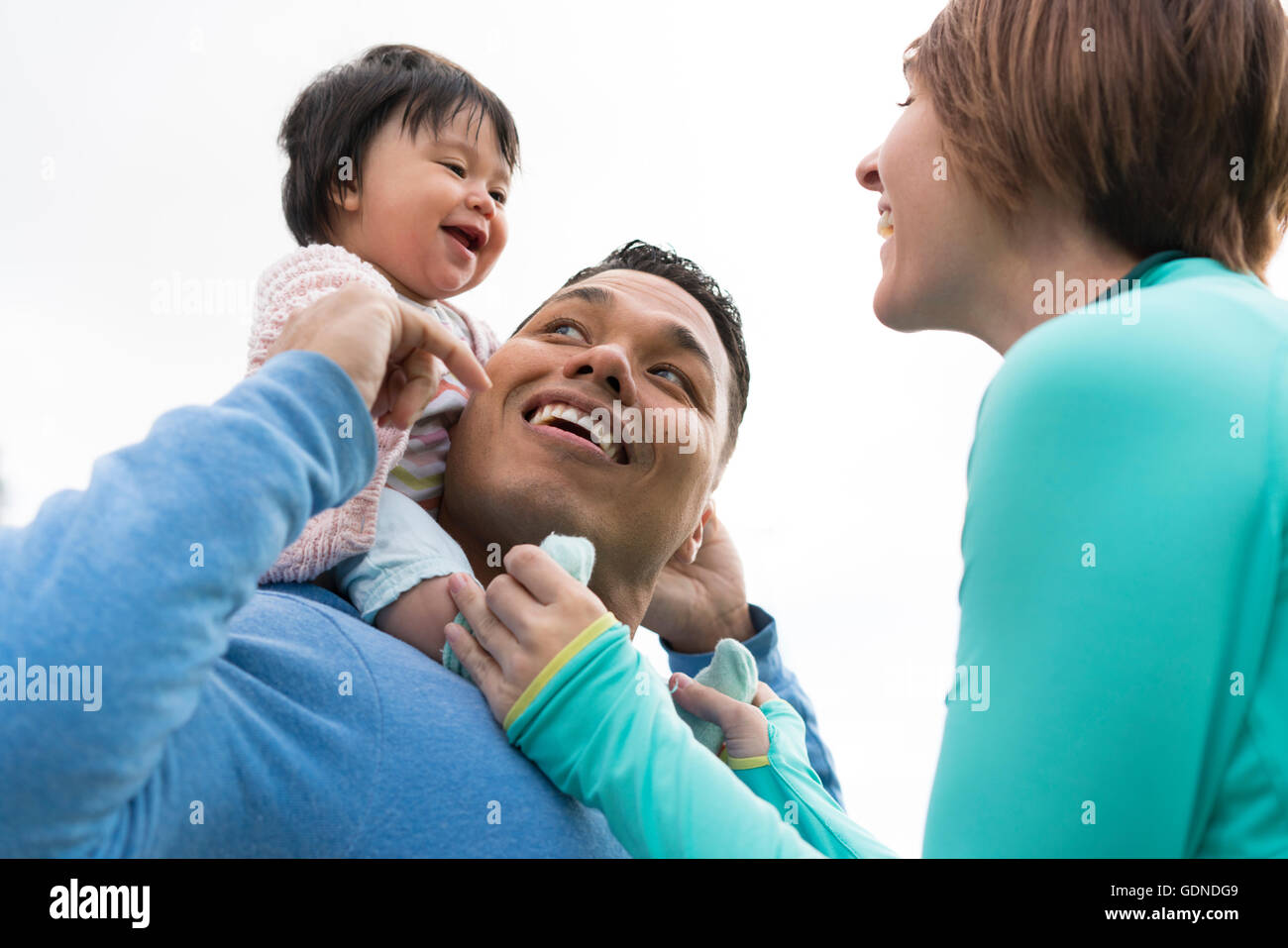 Couple playing piggyback ride in park Stock Photo - Alamy