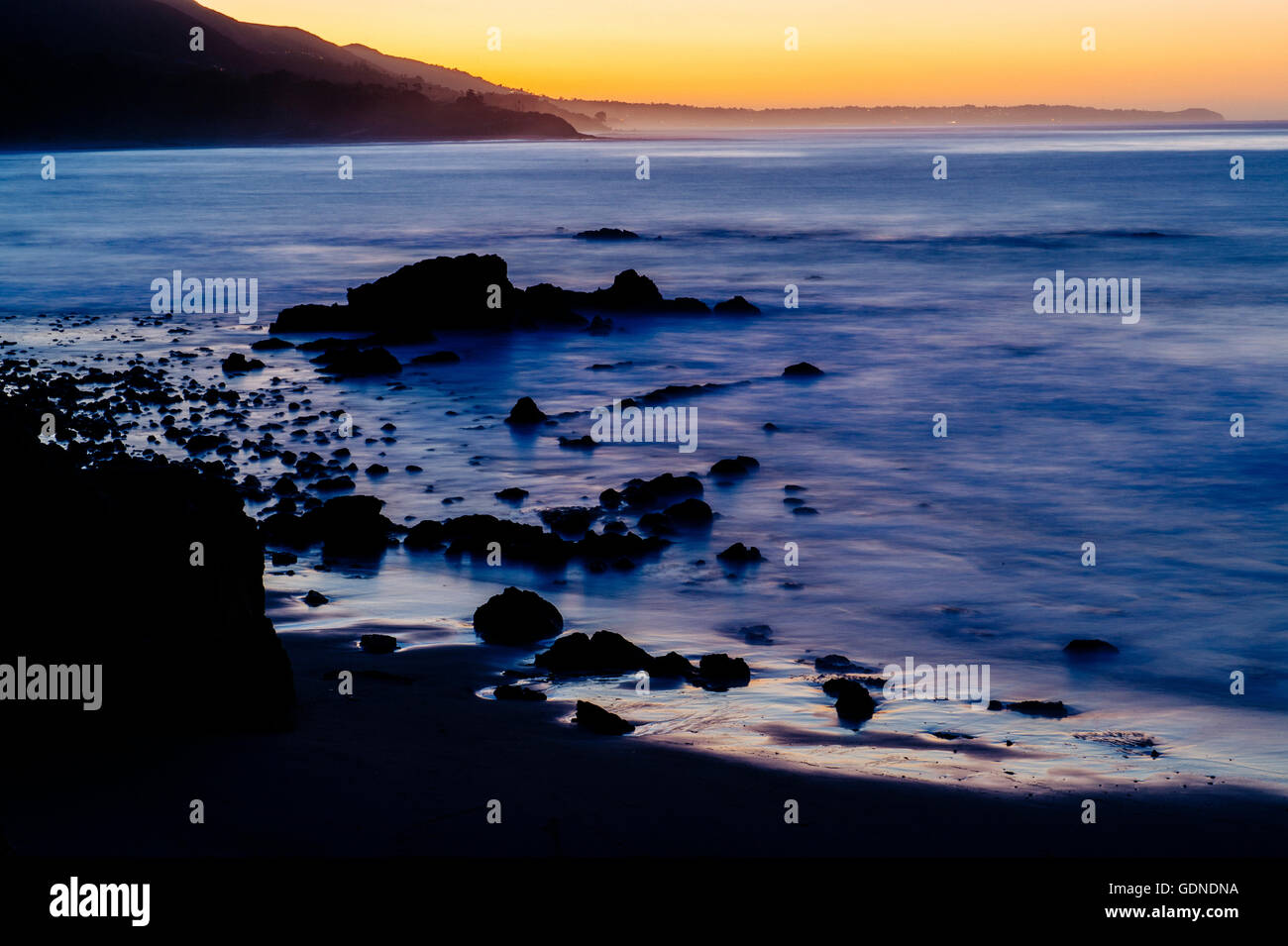 Elevated view of silhouetted beach at sunset, Los Angeles, California, USA Stock Photo